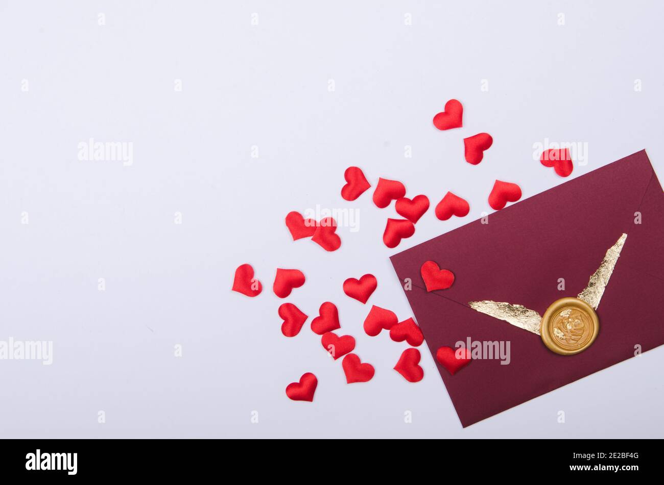 Envelope with love letter and red heart shape confetti. Valentines day ...