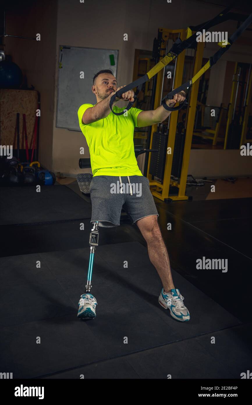 Life. Disabled man training in the gym of rehabilitation center