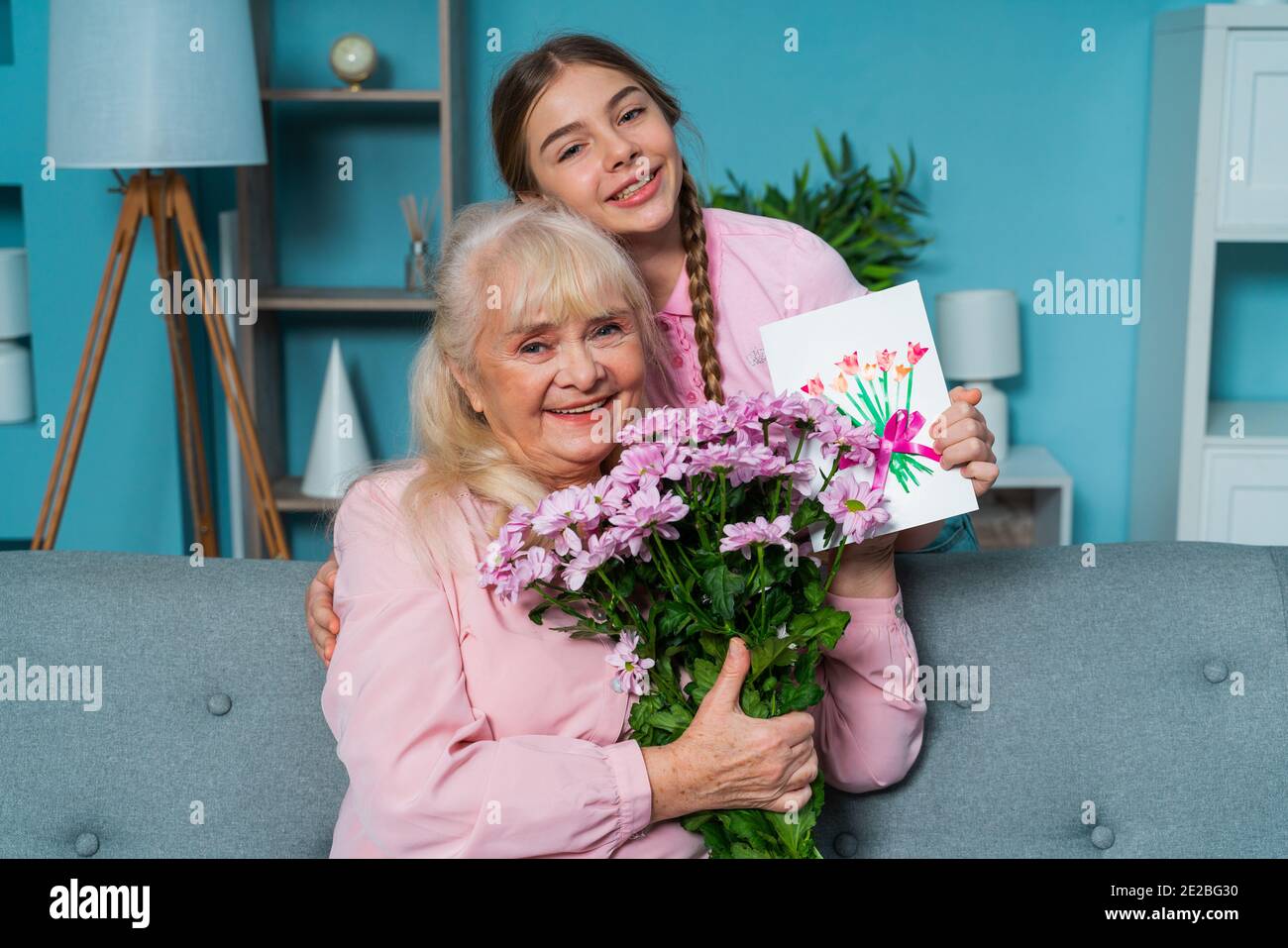 Grandaunt Cinematic portrait image of grandmother, and grandaughter sitting on ...