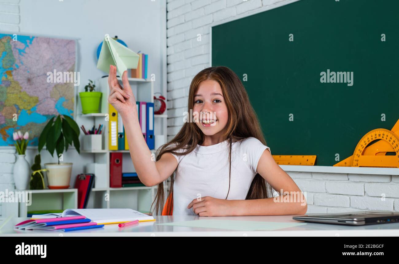 Pupil girl study at school in workplace classroom, learning Stock Photo ...
