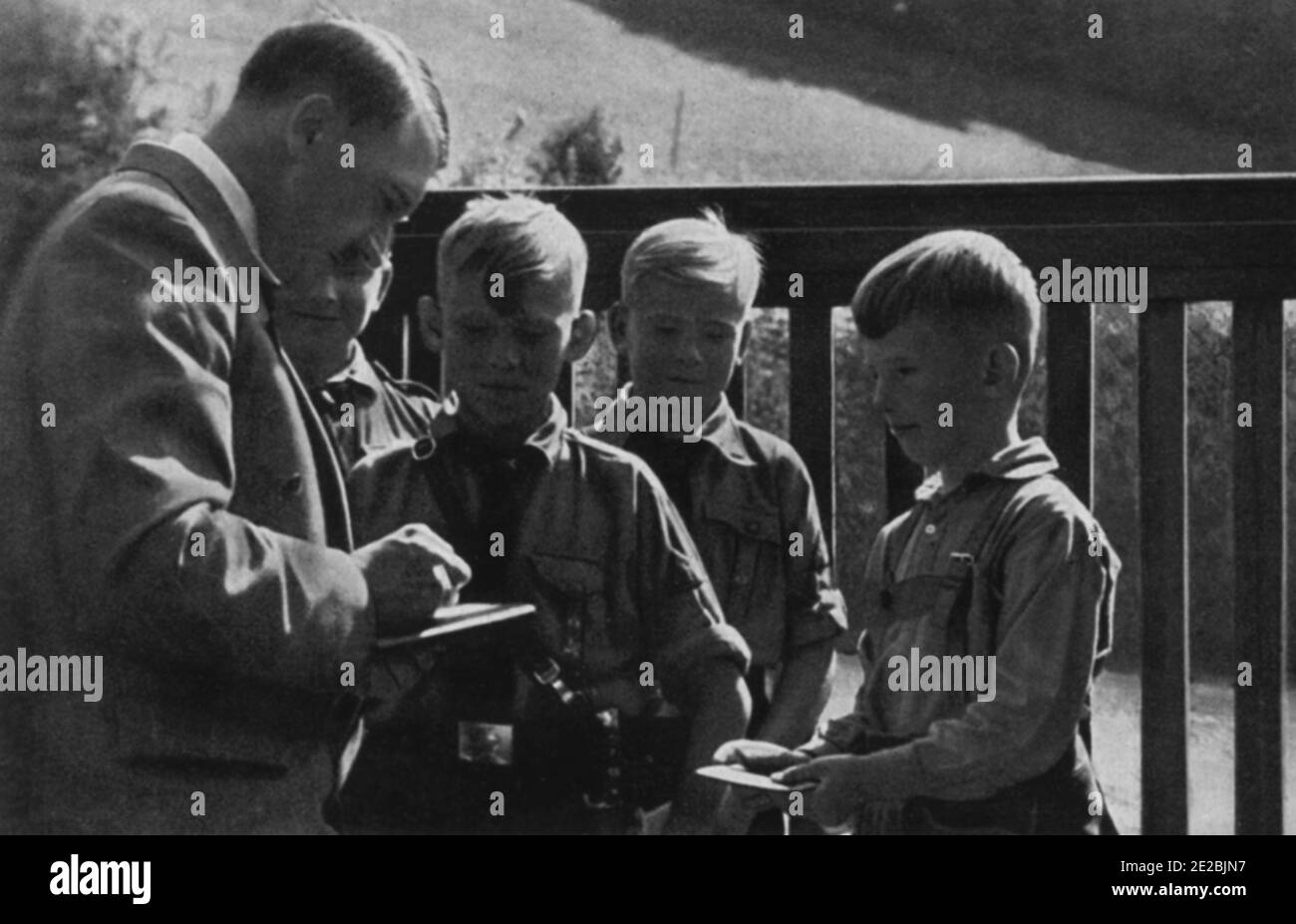 Young Hitler Youth members getting an autograph from Hitler. Stock Photo