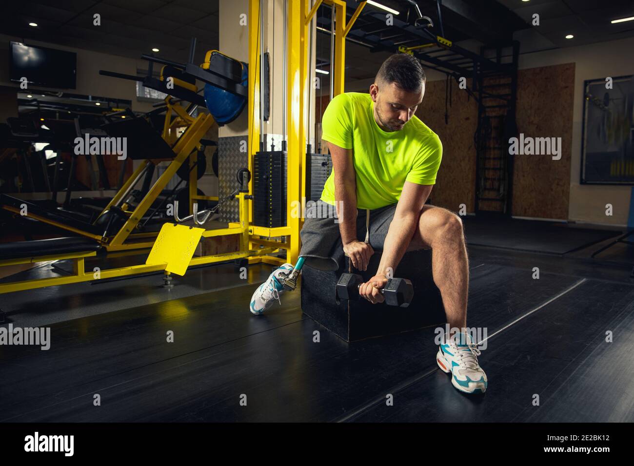Weights. Disabled man training in the gym of rehabilitation center,  practicing. Active man with handicap. Concept of healthy and active  lifestyle, motivation, concentration, inclusion and diversity Stock Photo -  Alamy