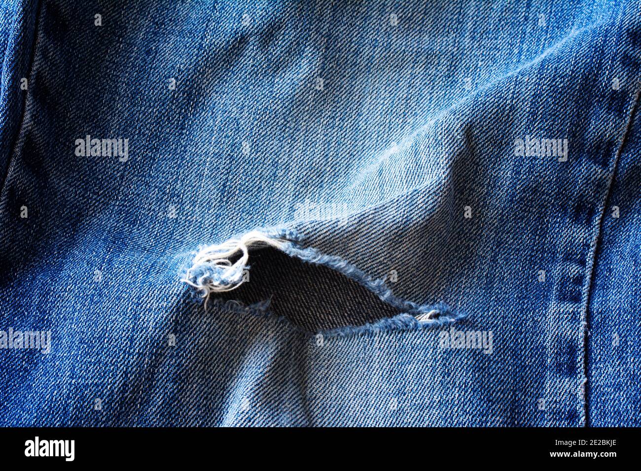 Ripped hole fabric hires stock photography and images Alamy