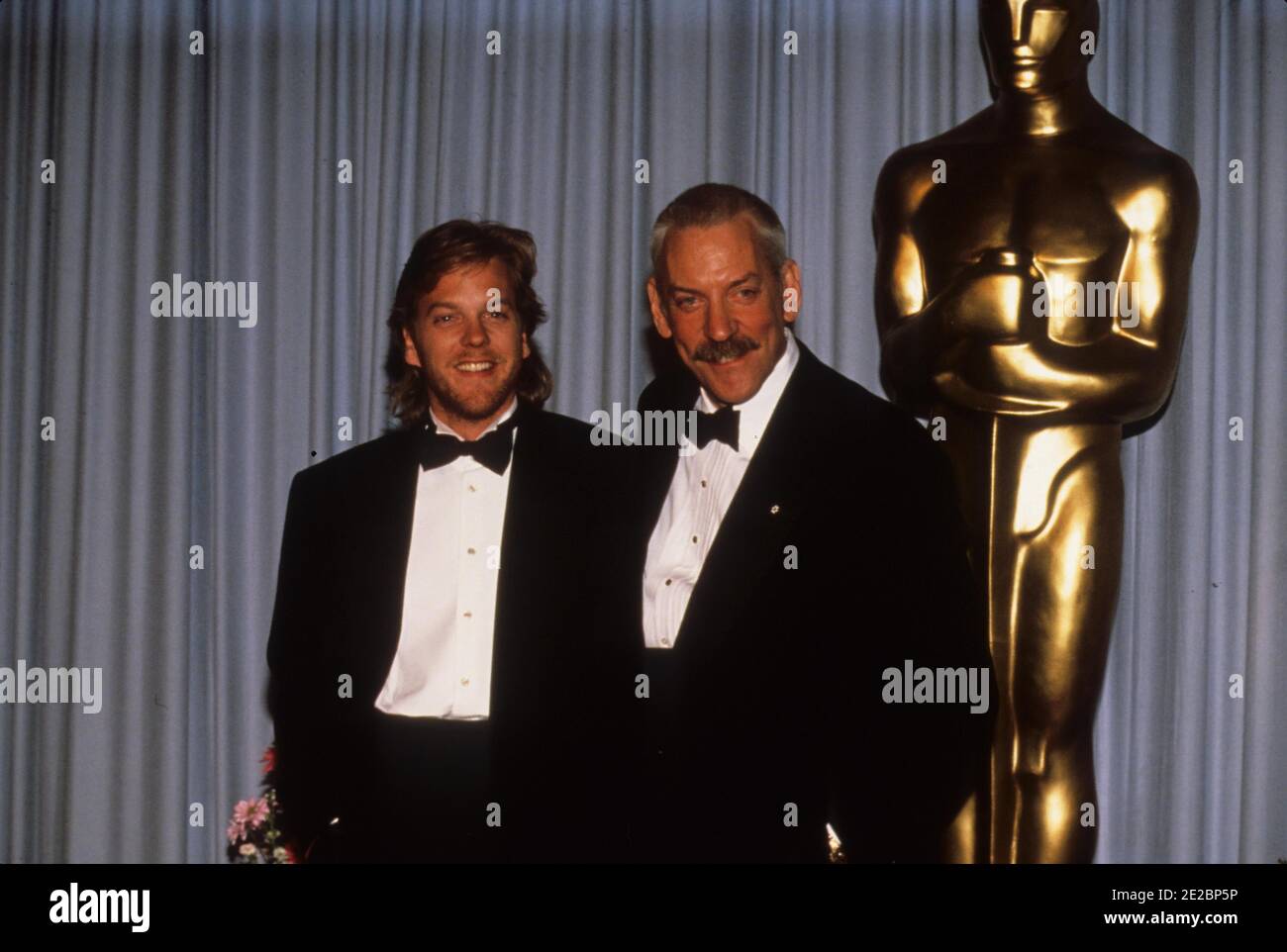 KIEFER SUTHERLAND with Donald Sutherland  at the 1991 Academy AwardsCredit: Ralph Dominguez/MediaPunch Stock Photo