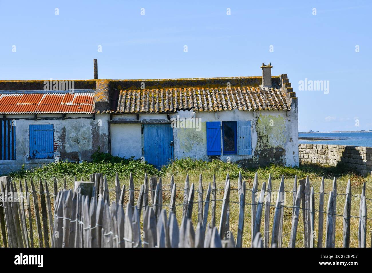 Old fisherman house on south Brittany coast whith blue shutters. Stock Photo