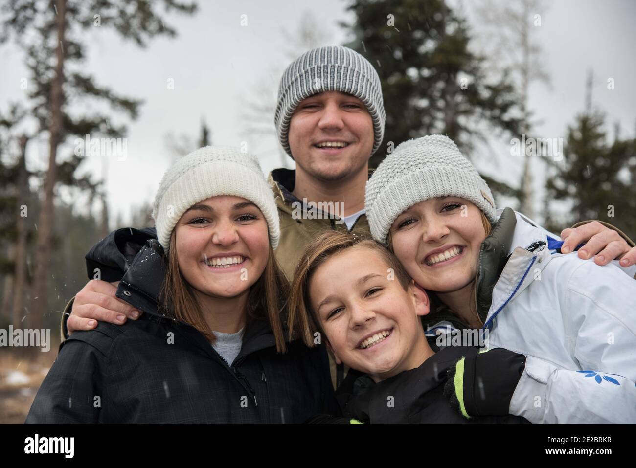 Family posing together on a winter outing. Stock Photo