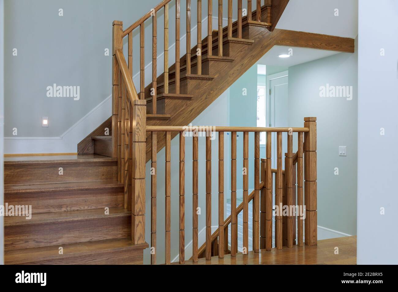 New home installing wooden railing for stairs for repairs under