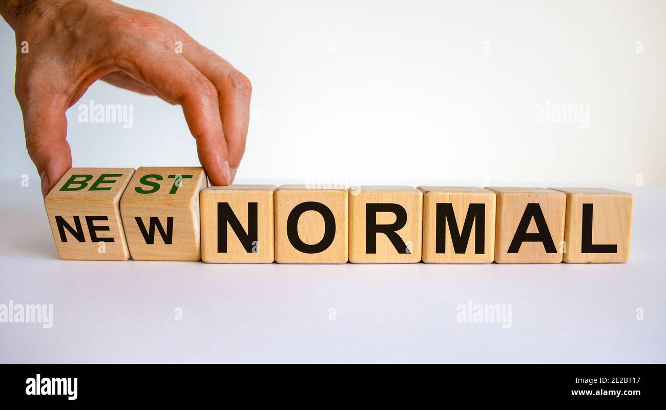 New best normal symbol. Hand turns cubes and changes words 'new normal ...