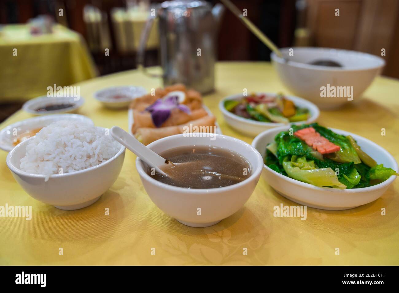 Vegetarian restaurant, Po Lin Monastery (Lantau Island, Hong Kong, China). Delicious asian food. Soup, Rice, steamed vegetables, spring rolls Stock Photo