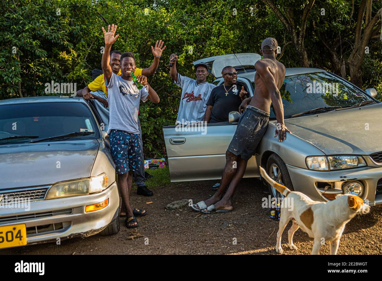 Local People in Happy Hill, Grenada. Hash House Harriers Running Event in Happy Hill, Grenada. For young and old the defilee of the Hasher is a welcome change; especially since one always gets along well with the beer Stock Photo