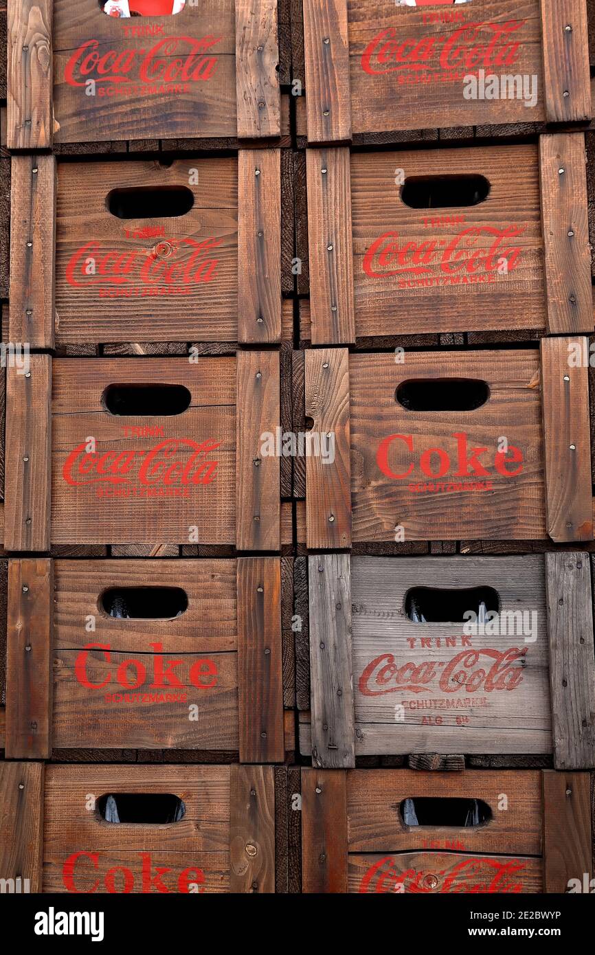 Wooden old Coca-Cola cases stacked up for delivery. Germany Europe. Stock Photo