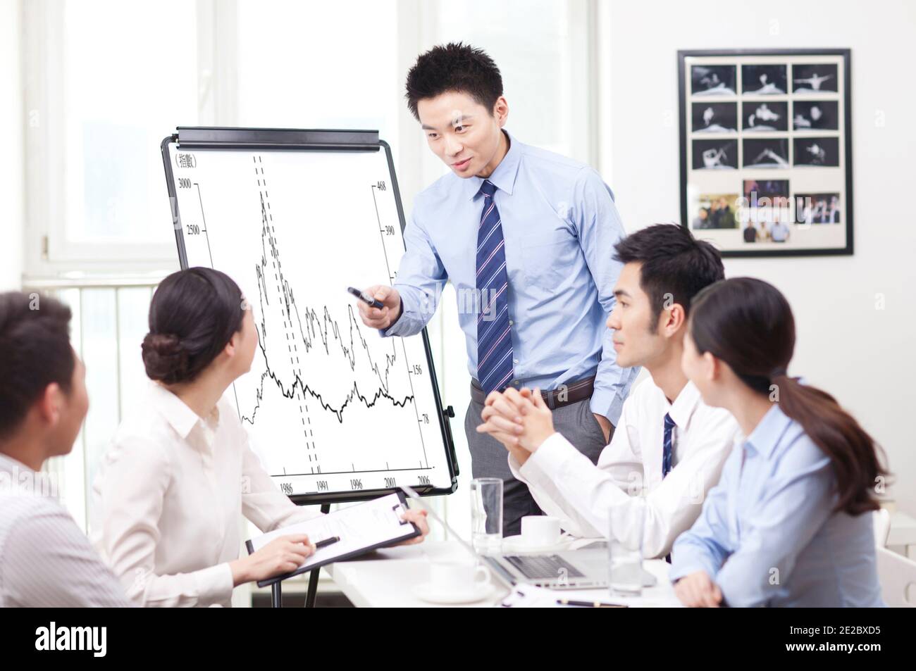 Man giving presentation to co-workers high quality photo Stock Photo