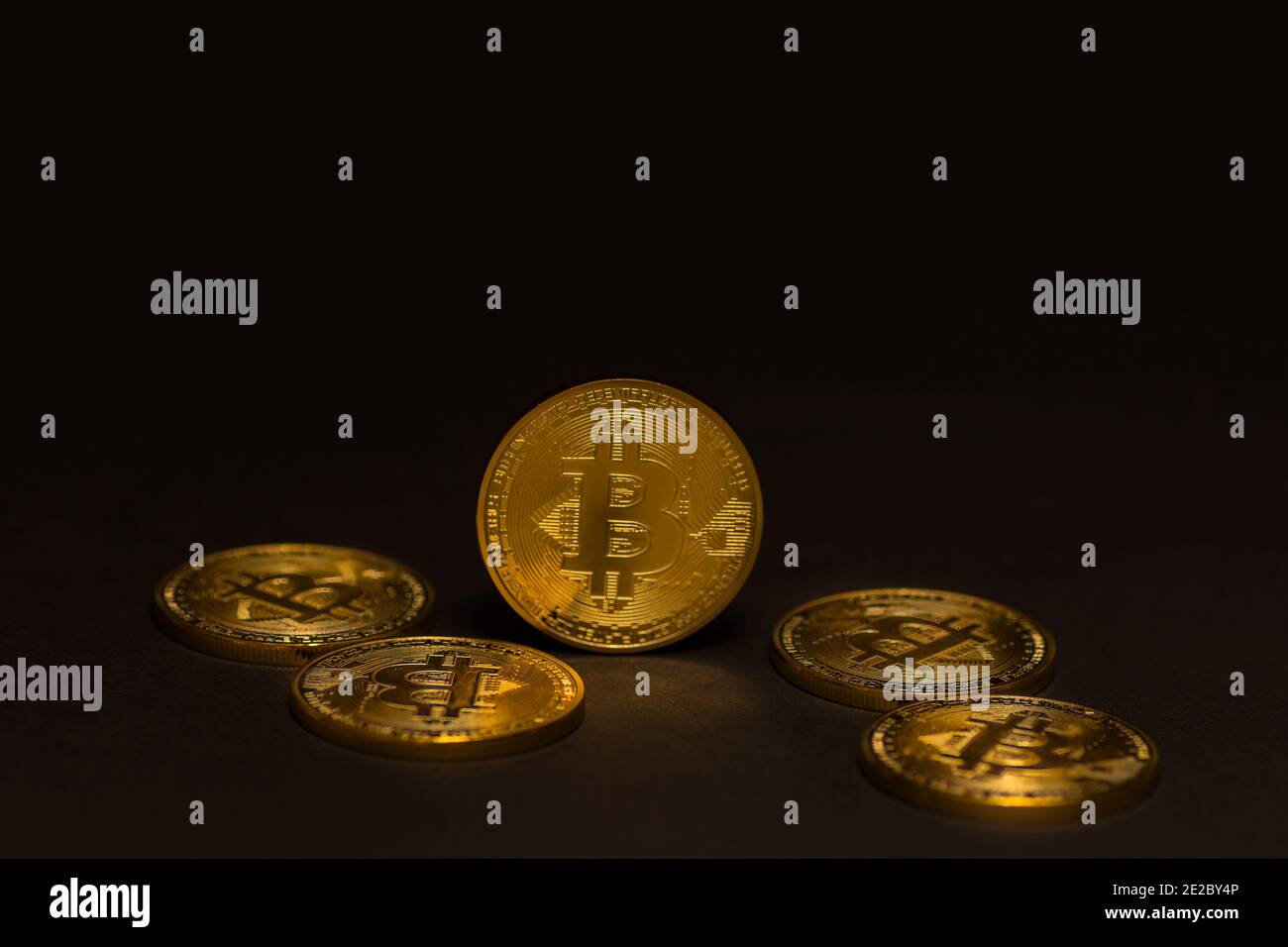 Bitcoin coin the most expensive crypto currency, bitcoin on the top,  dollars background photo Stock Photo - Alamy