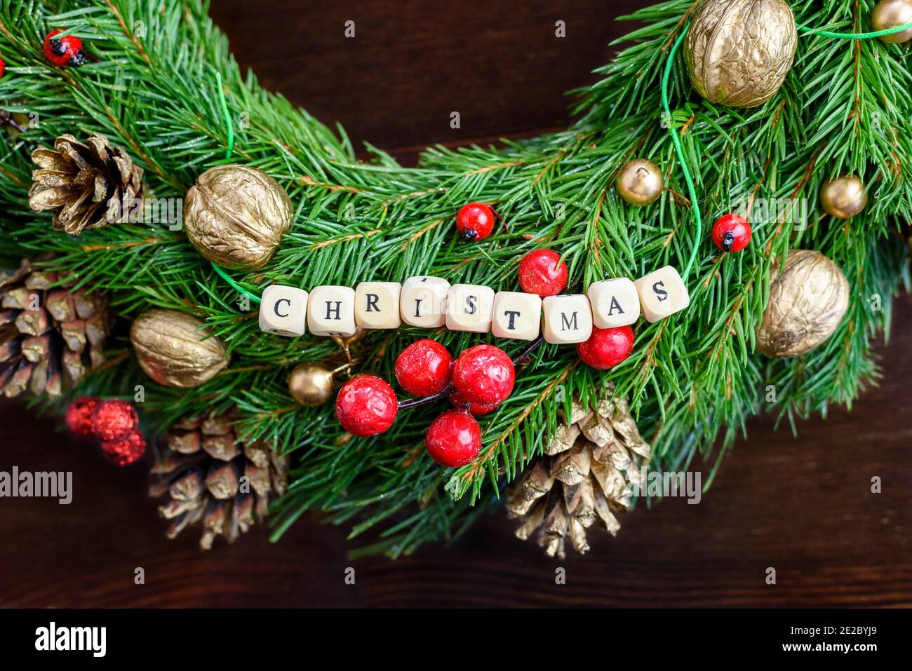Beautiful Christmas wreath with 'Christmas' letters, top view, juicy colors Stock Photo