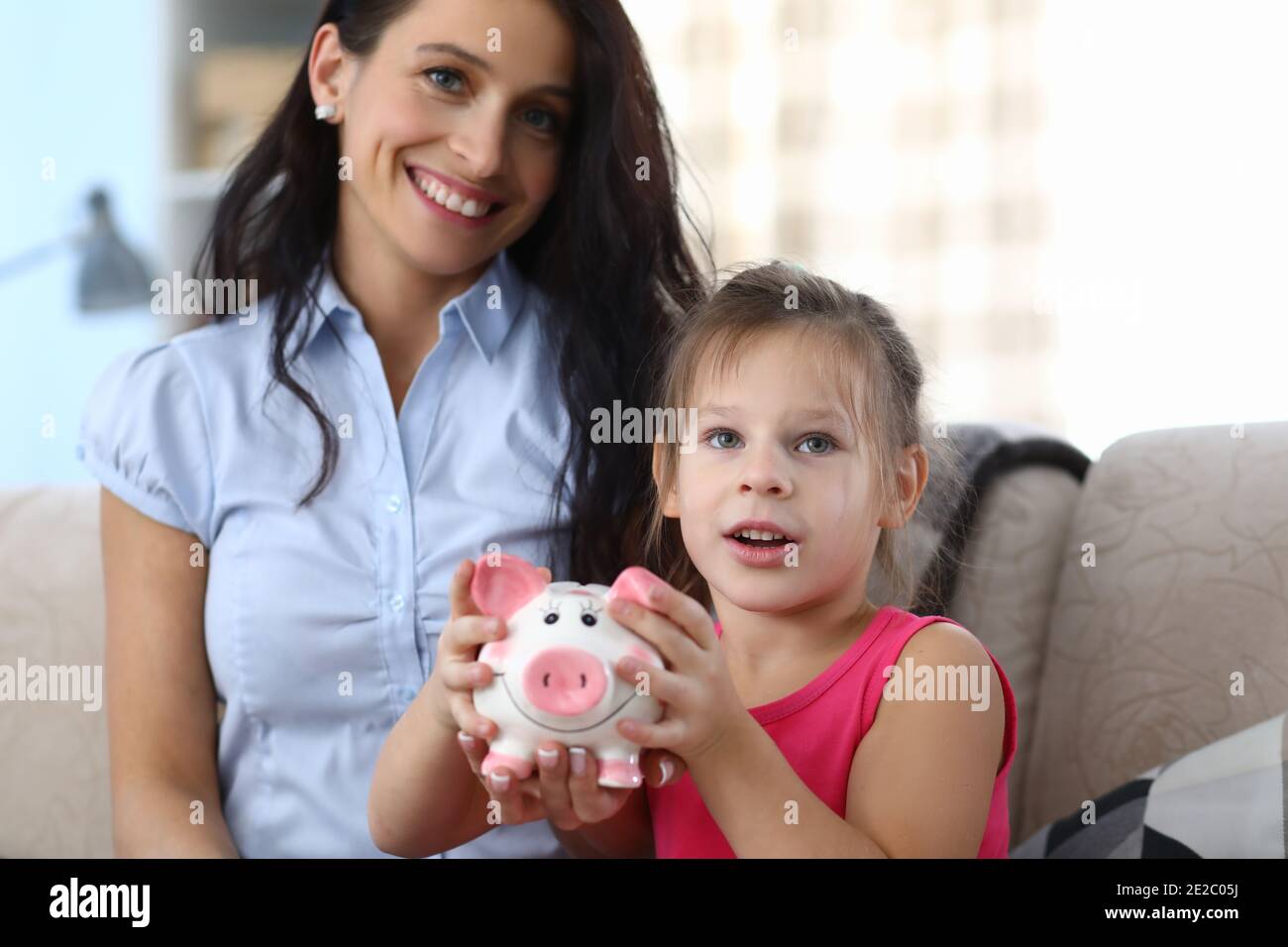 Child holding money box Stock Photo