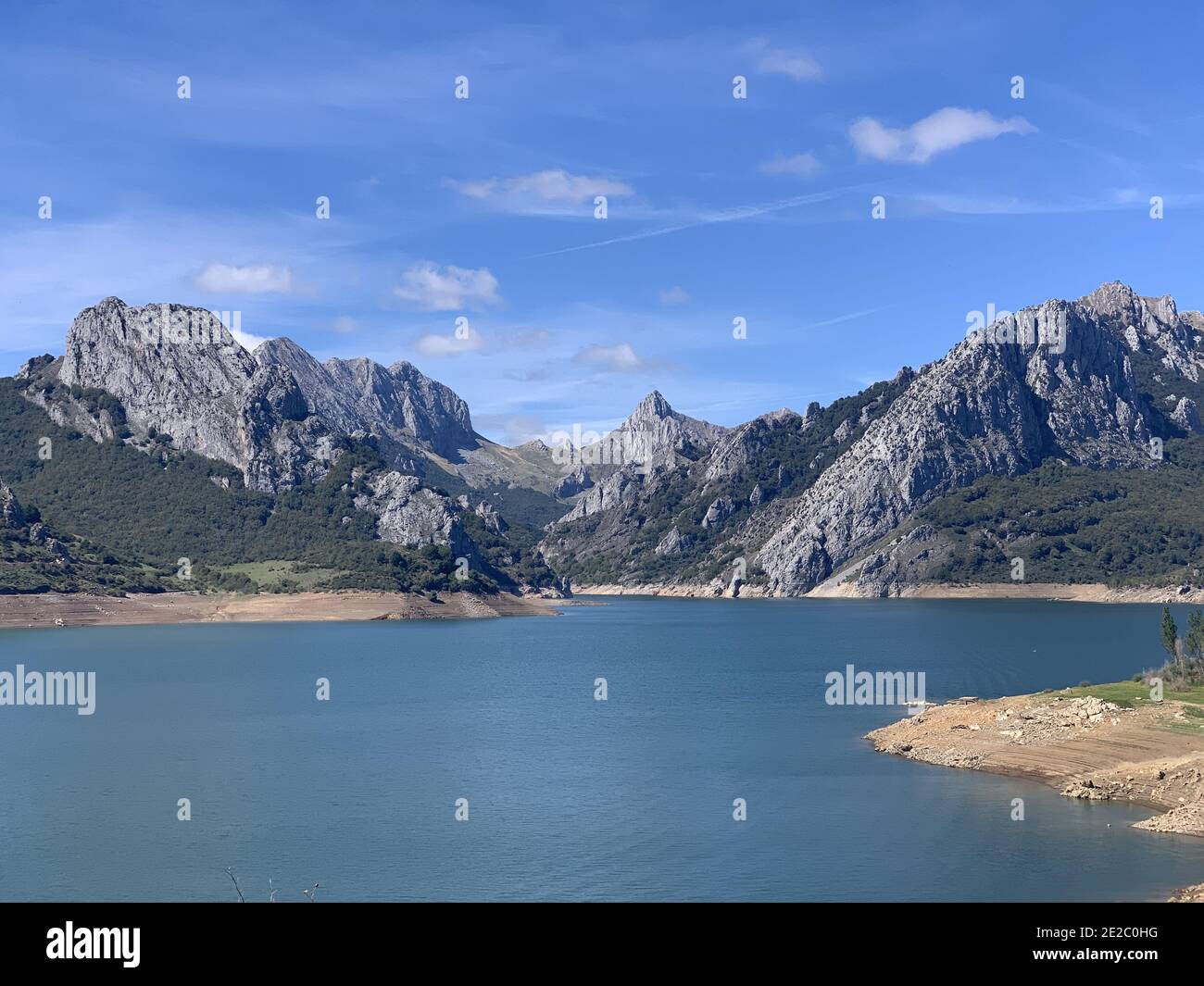 Beautiful shot of the lake and mountains at Riano reservoir, Spain Stock Photo