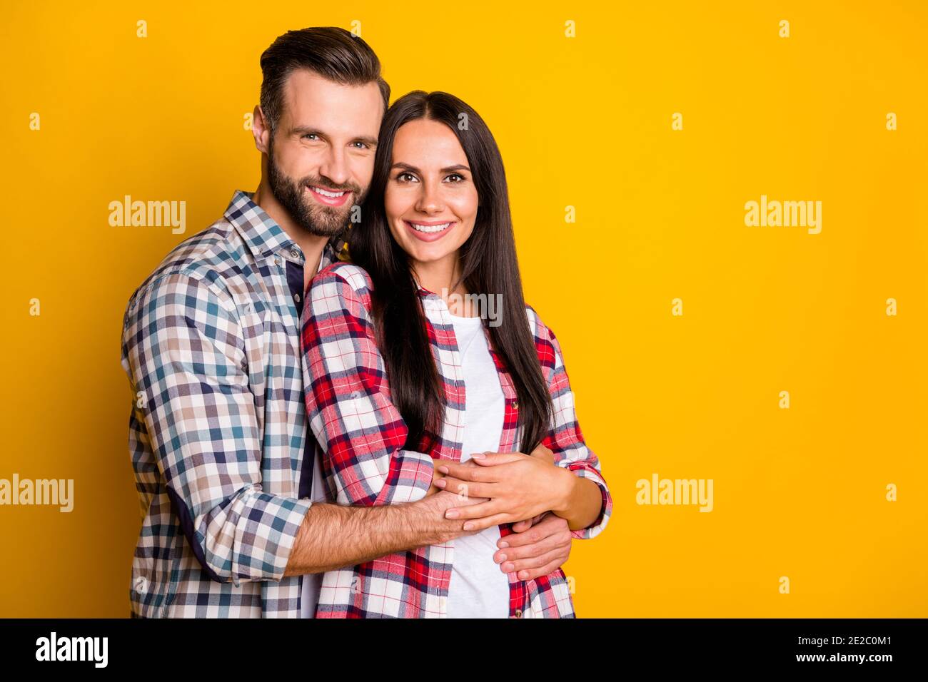 Photo portrait of man hugging woman from behind isolated on vivid ...