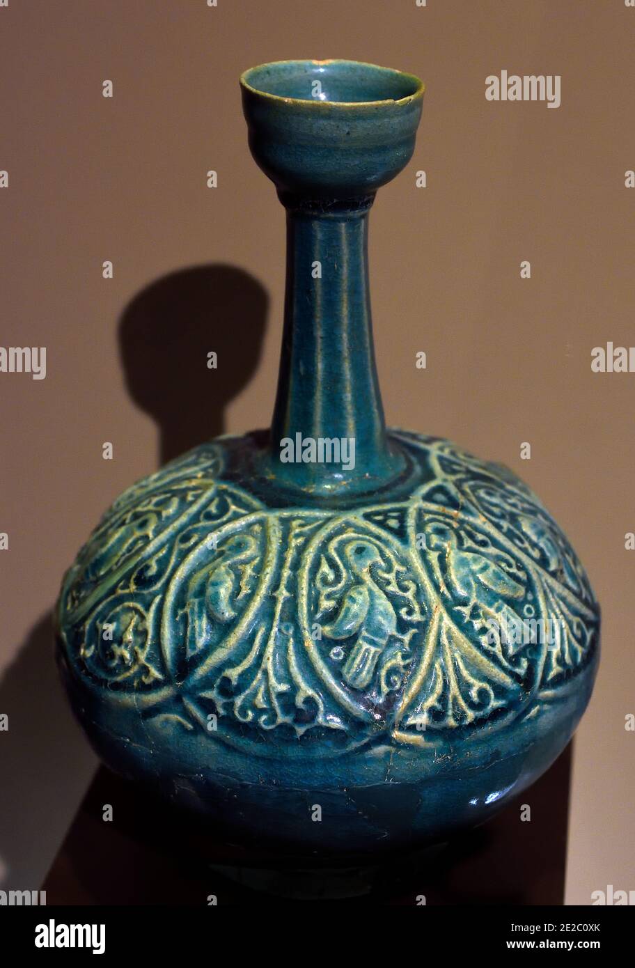 Bottle Seljuq period 12th - 13th Century (1040-1157) IRAN, KASHAN Frit body, overglaze lustre decoration, opaque white glaze (Kashan is a city in Iran, In the Middle Ages, it was also known for ceramics, 12th - 14th century, high quality pottery and tiles.) Stock Photo