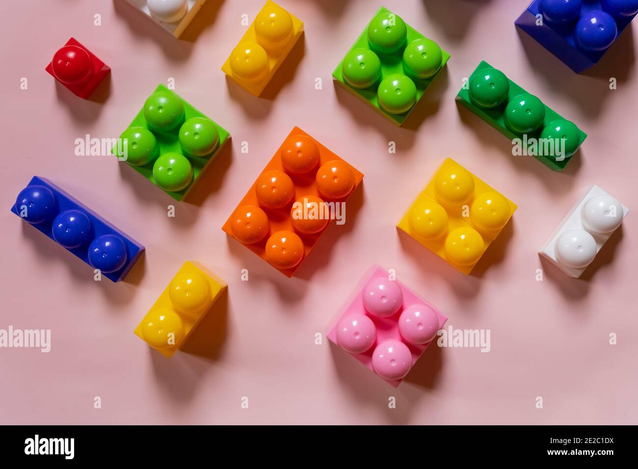 Toys background. Colorful wooden cubes and plastic construction blocks ...