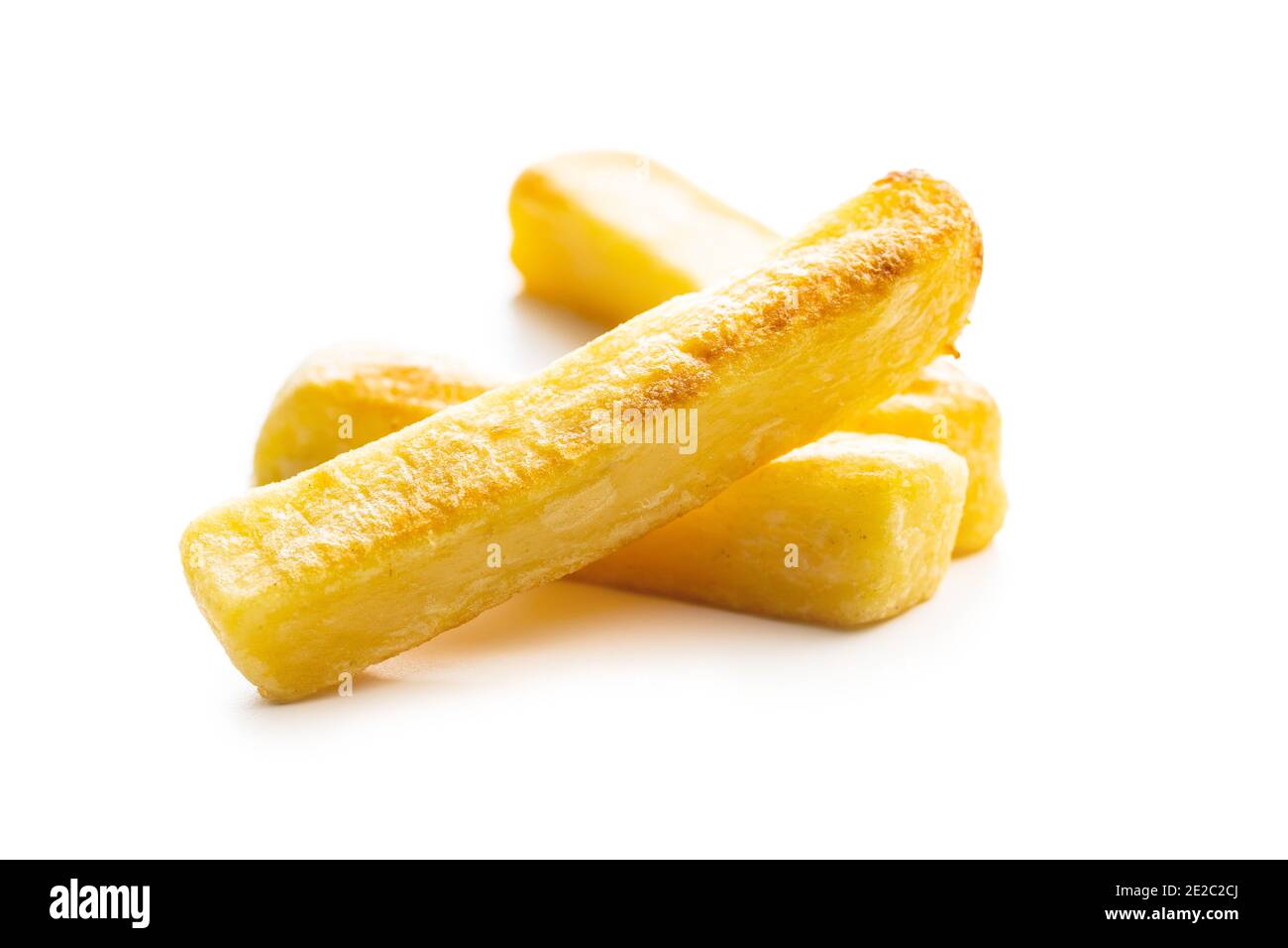 Big french fries. Fried potato chips isolated on white background. Stock Photo