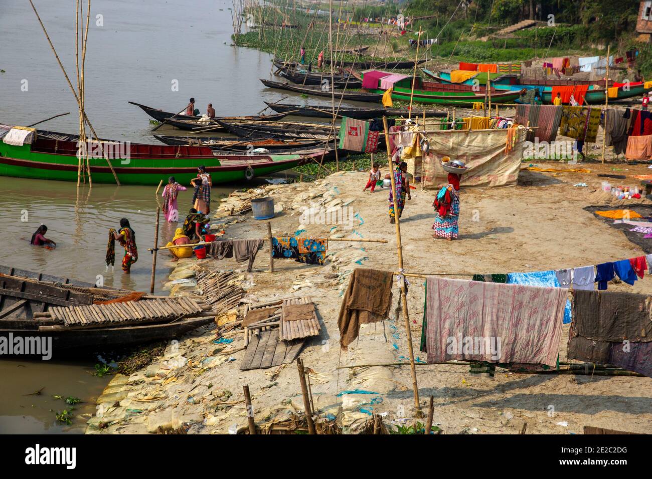 Women bathing in the Titas River at Brahmanbaria, Bangladesh. Stock Photo