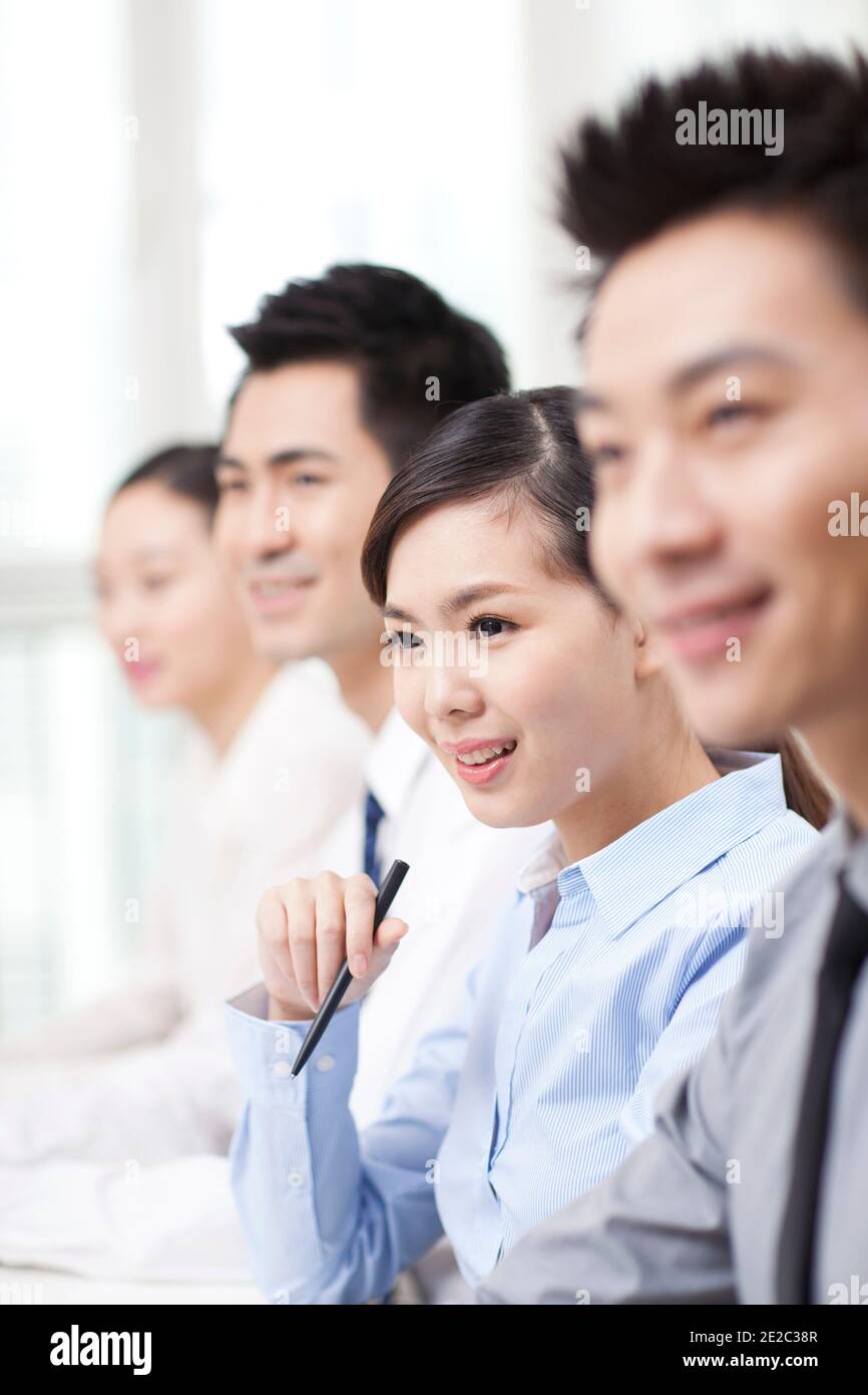 Group of business people sitting at conference table high quality photo ...