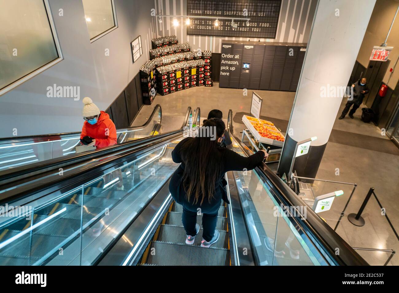 Customers exit and enter the Whole Foods Manhattan West in the Hudson Yards neighborhood of New York on Tuesday, January 12, 2021. (© Richard B. Levine) Stock Photo