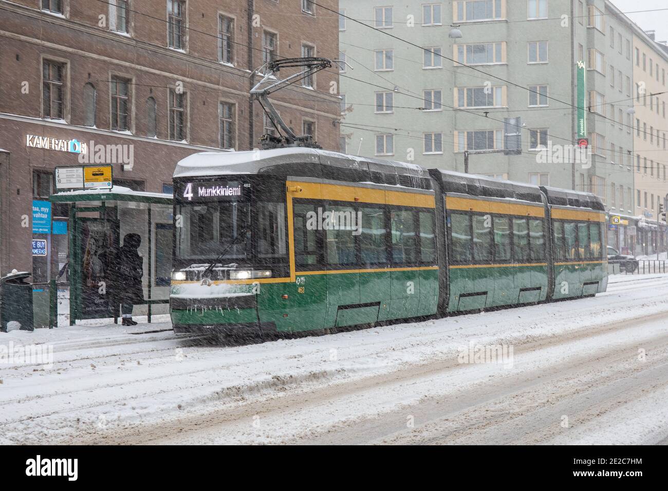 Tram 462 on line 4 during heavy snowfall in Taka-Töölö district of Helsinki, Finland Stock Photo