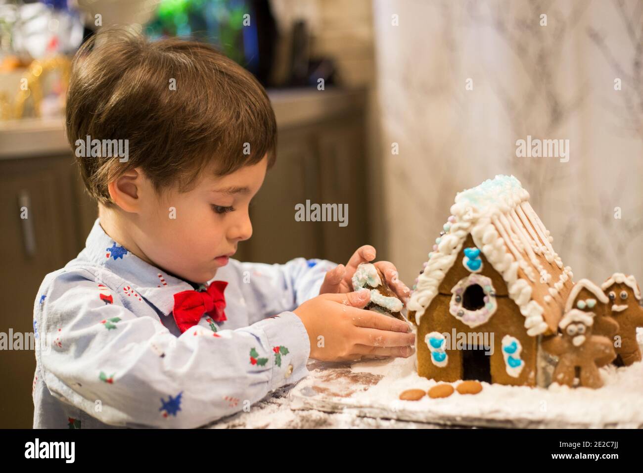 Cute boy making cookie Stock Photo - Alamy
