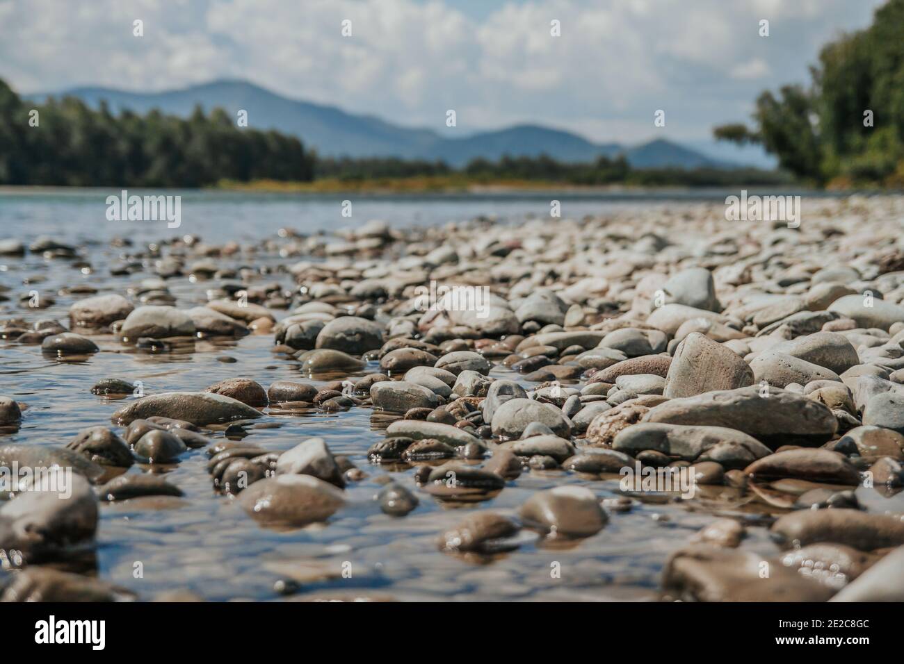 Rocky River Rounded Rocks Round stones on the banks of a mountain river. Rocky beach Stock Photo ...