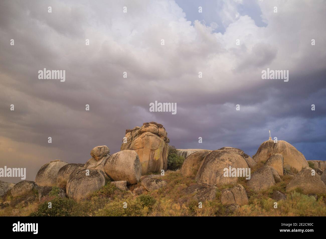 Cloudy sunset over Treasure rocks of Los Barruecos Natural Monument, Caceres, Extremadura, Spain Stock Photo