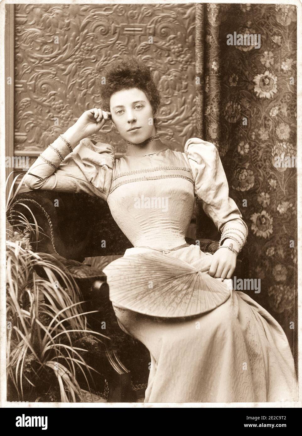Victorian portrait of an unknown fashionable young woman wearing a wasp  waisted dress with leg of mutton sleeves. Dates to c1896. Photo by John Tom  Drinkwater Butt (died 1929 Stock Photo - Alamy