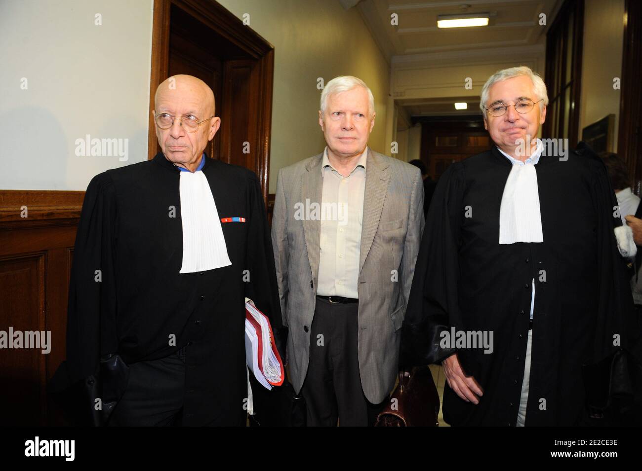 FFrenchman Andre Bamberski arrives with his lawyers Francois Gibault and Laurent de Caunes at the Palais de Justice for German cardiologist Dieter Krombach's trial for the murder of Kalinka Bamberski, in Paris, France on October 4, 2011. The French court today decided to continue the trial of the German doctor, who is accused of having raped and killed his then 14-year-old stepdaughter, Kalinka Bamberski, in the summer of 1982 while she was holidaying with her mother at Krombach's home at Lake Constance, southern Germany. A court in Germany ruled that Krombach could not be held responsible for Stock Photo