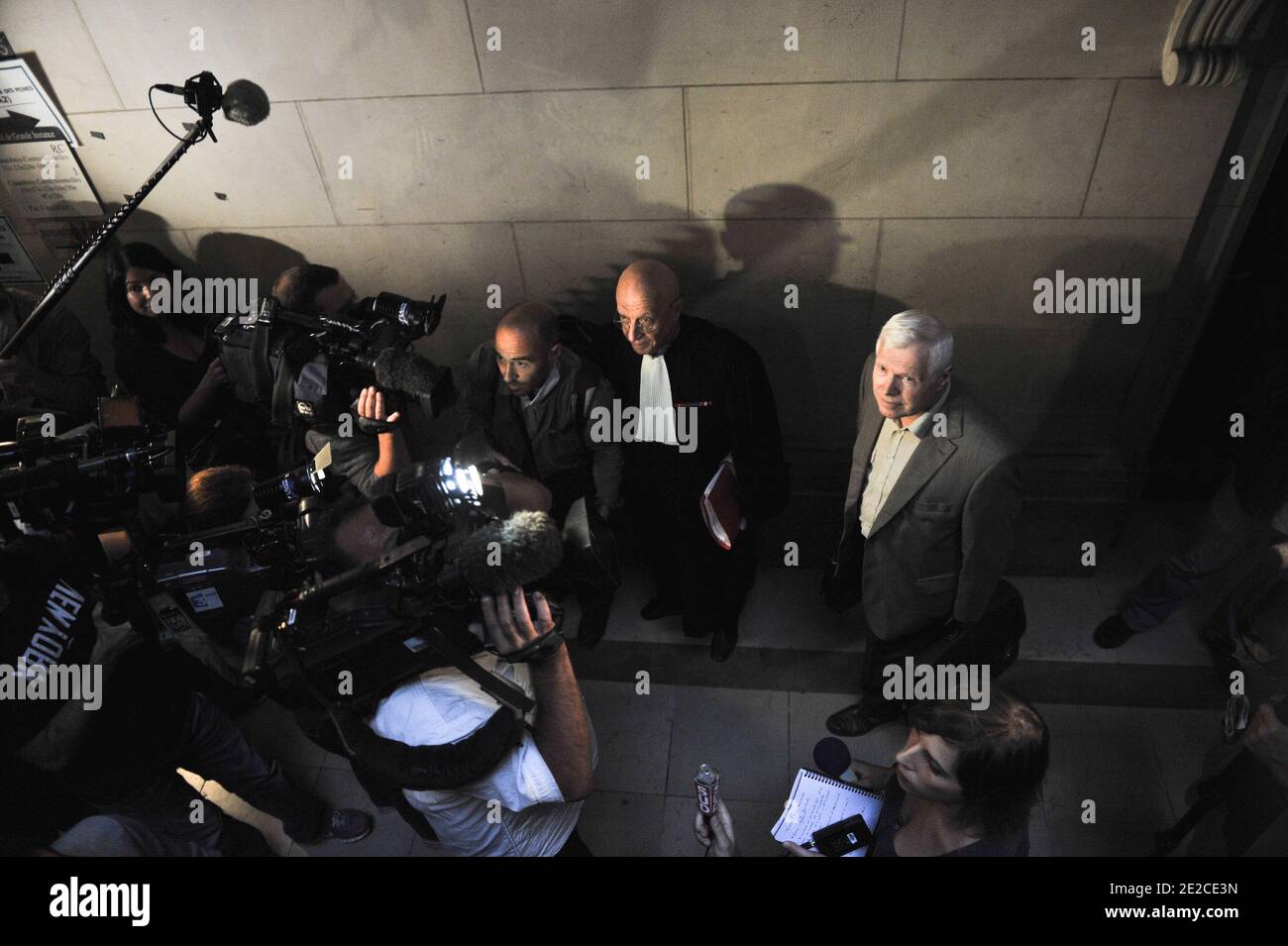 Frenchman Andre Bamberski arrives with his lawyers at the Palais de Justice for German cardiologist Dieter Krombach's trial for the murder of Kalinka Bamberski, in Paris, France on October 4, 2011. The French court today decided to continue the trial of the German doctor, who is accused of having raped and killed his then 14-year-old stepdaughter, Kalinka Bamberski, in the summer of 1982 while she was holidaying with her mother at Krombach's home at Lake Constance, southern Germany. A court in Germany ruled that Krombach could not be held responsible for the death, but in 1995 a court in Paris Stock Photo