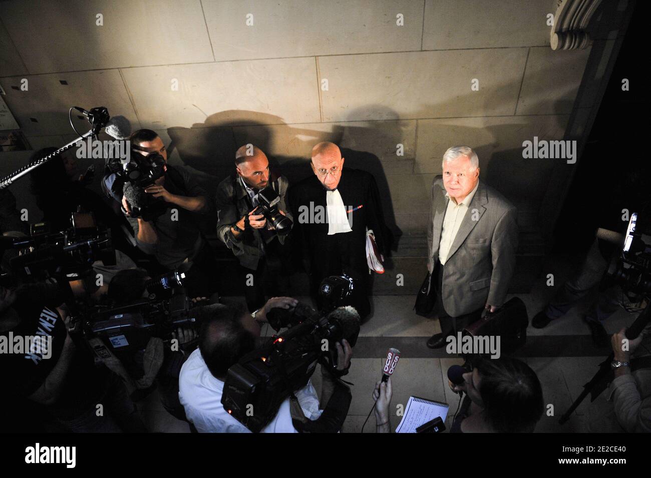 Frenchman Andre Bamberski arrives with his lawyers at the Palais de Justice for German cardiologist Dieter Krombach's trial for the murder of Kalinka Bamberski, in Paris, France on October 4, 2011. The French court today decided to continue the trial of the German doctor, who is accused of having raped and killed his then 14-year-old stepdaughter, Kalinka Bamberski, in the summer of 1982 while she was holidaying with her mother at Krombach's home at Lake Constance, southern Germany. A court in Germany ruled that Krombach could not be held responsible for the death, but in 1995 a court in Paris Stock Photo