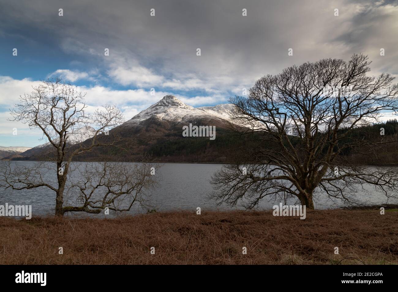 The Pap of Glencoe (Sgorr na Ciche) with a covering of snow, viewed from the north side of Loch Leven, Lochaber, Scotland. Stock Photo