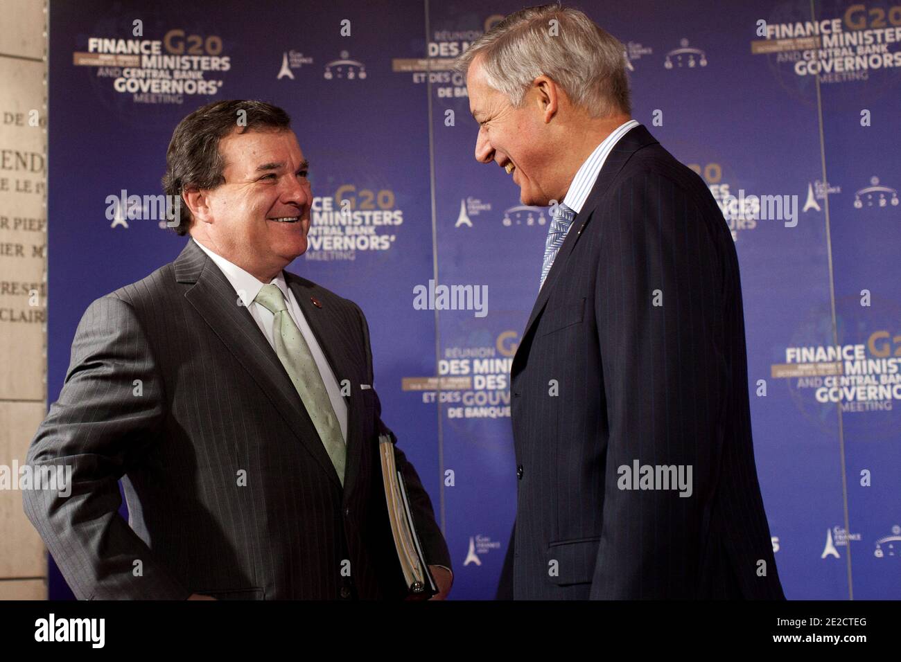 Canadian Finance Minister Jim Flaherty is received by French central bank governor Christian Noyer at her arrival at the Finance Ministry in Paris, France on October 15, 2011 to G20 meeting of Finance Ministers and Central Bank Governors. Finance ministers and central bank governors of the world's leading economies are gathering in Paris to discuss how to save Greece from bankruptcy. Photo by Stephane Lemouton/ABACAPRESS.COM Stock Photo