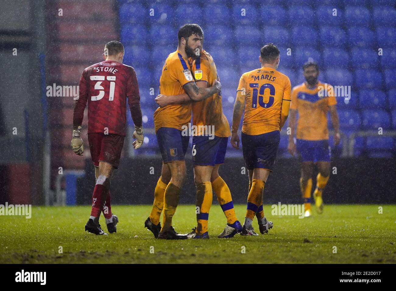 Mansfield Town players Farrend Rawson and Davis Keillor-Dunn congratulate each other at the end of the Sky Bet League Two match at the Boundary Park, Oldham. Stock Photo