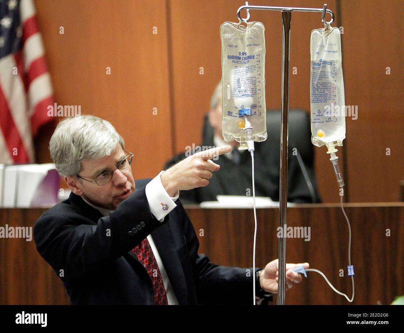 Anesthesiology expert Dr. Steven Shafer, left, demonstrates the use of propofol after placing a propofol bottle in an empty saline bag during Dr. Conrad Murray's involuntary manslaughter trial in Los Angeles on October 20, 2011. Murray has pleaded not guilty and faces four years in prison and the loss of his medical license if convicted of involuntary manslaughter in Michael Jackson's death. Photo by Reed Saxon/Pool/ABACAPRESS.COM Stock Photo