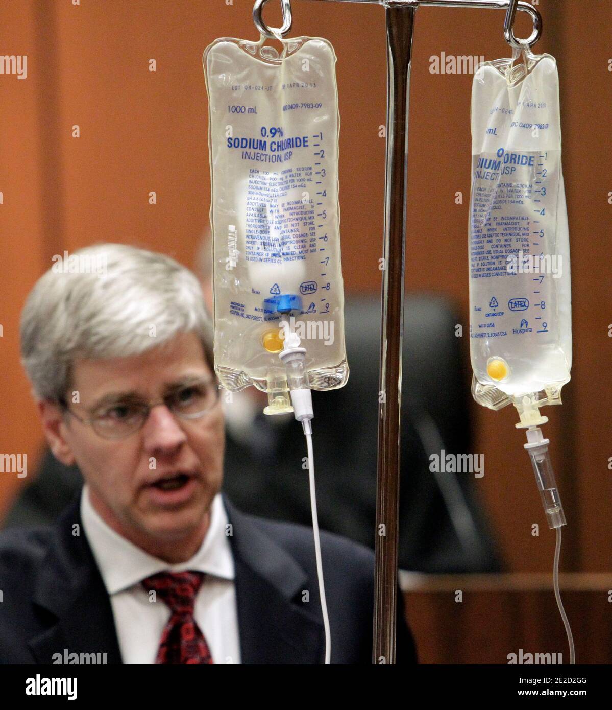 Anesthesiology expert Dr. Steven Shafer, background left, demonstrates the use of propofol while testifying during Dr. Conrad Murray's involuntary manslaughter trial in Los Angeles on October 20, 2011. Murray has pleaded not guilty and faces four years in prison and the loss of his medical license if convicted of involuntary manslaughter in Michael Jackson's death. Photo by Reed Saxon/Pool/ABACAPRESS.COM Stock Photo