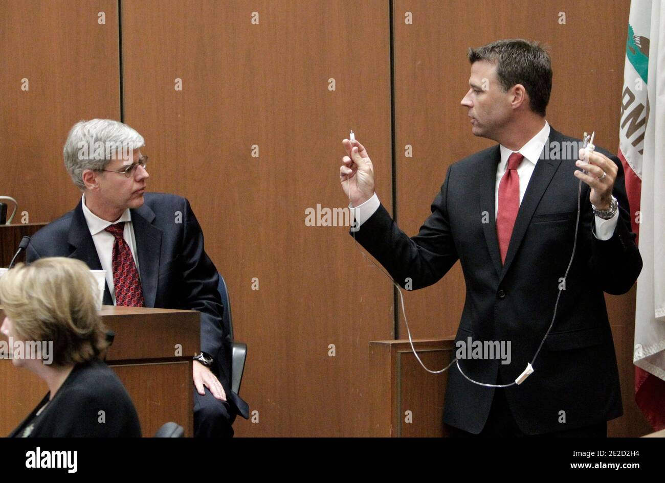 Deputy district attorney David Walgren, right, holds an infusion tube as he examines anesthesiology expert Dr. Steven Shafer during Dr. Conrad Murray's involuntary manslaughter trial in Los Angeles on October 20, 2011. Murray has pleaded not guilty and faces four years in prison and the loss of his medical license if convicted of involuntary manslaughter in Michael Jackson's death. Photo by Reed Saxon/Pool/ABACAPRESS.COM Stock Photo