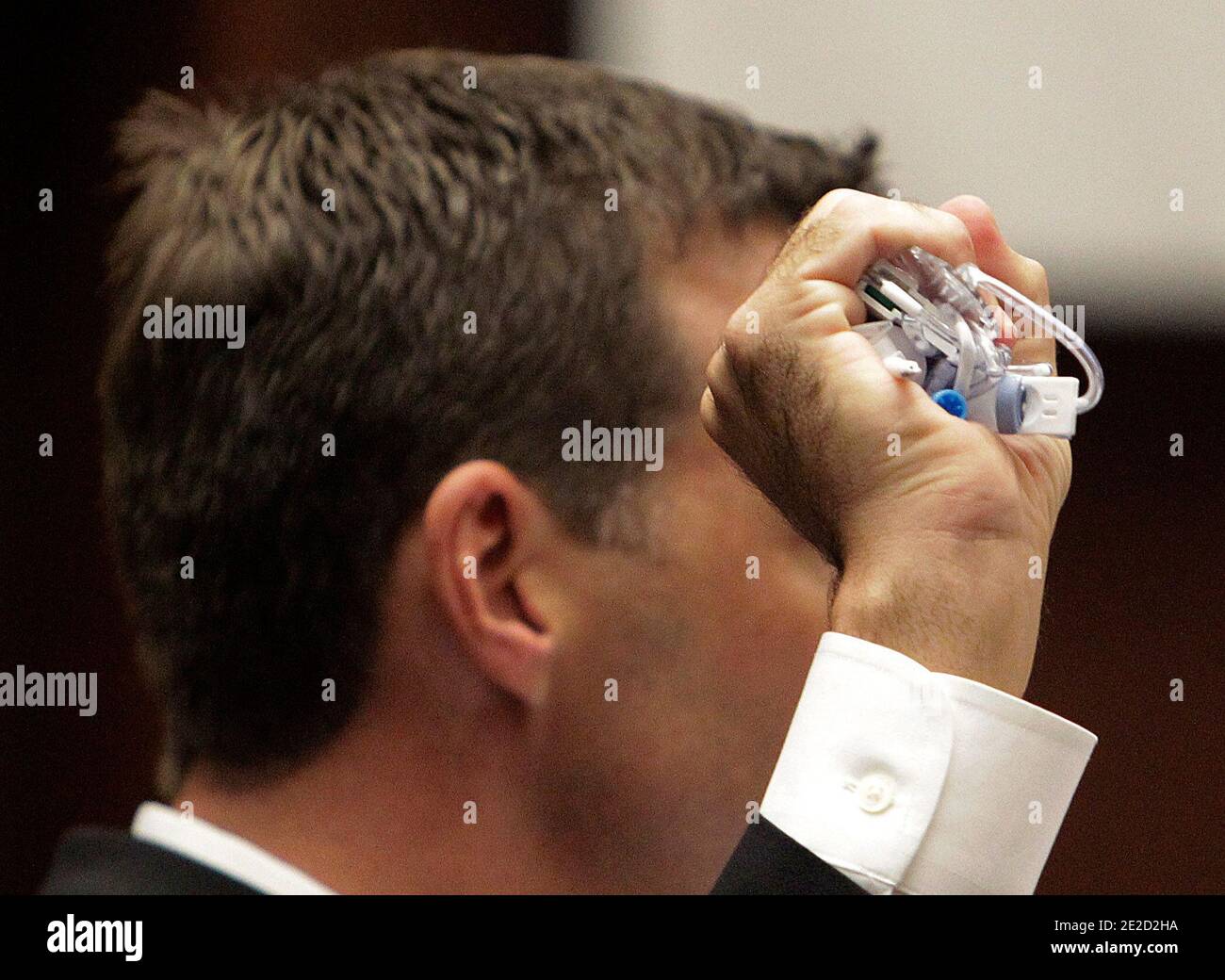 Deputy district attorney David Walgren holds an intravenous drip tube as he examines anesthesiology expert Dr. Steven Shafer during Dr. Conrad Murray's involuntary manslaughter trial in Los Angeles on October 20, 2011. Murray has pleaded not guilty and faces four years in prison and the loss of his medical license if convicted of involuntary manslaughter in Michael Jackson's death. Photo by Reed Saxon/Pool/ABACAPRESS.COM Stock Photo