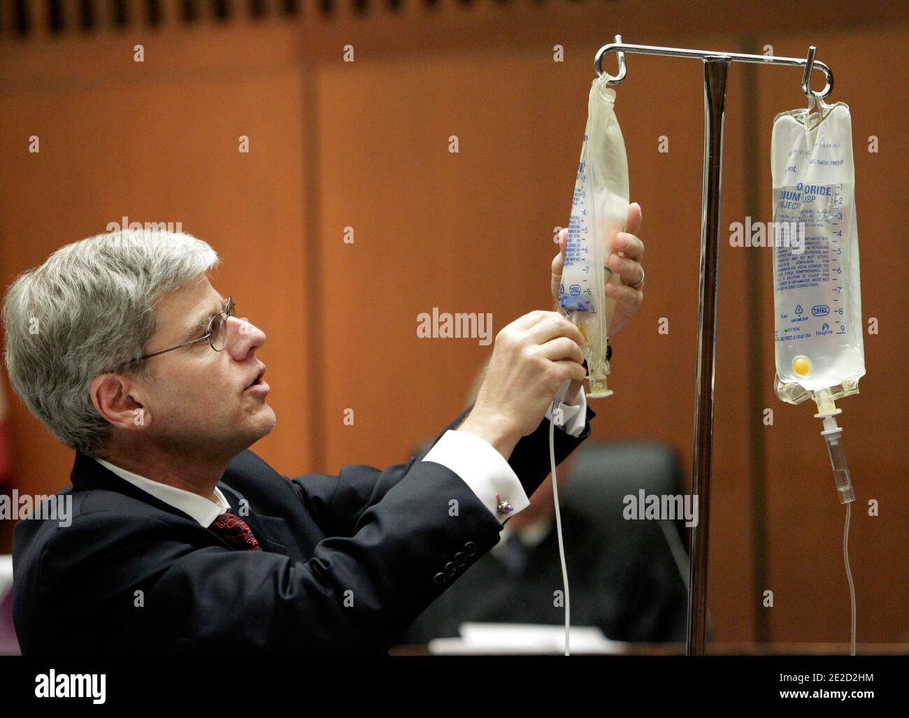 Anesthesiology expert Dr. Steven Shafer, left, places a bottle of propofol into an empty saline bag as he demonstrates the use of propofol during Dr. Conrad Murray's involuntary manslaughter trial in Los Angeles on October 20, 2011. Murray has pleaded not guilty and faces four years in prison and the loss of his medical license if convicted of involuntary manslaughter in Michael Jackson's death. Photo by Reed Saxon/Pool/ABACAPRESS.COM Stock Photo