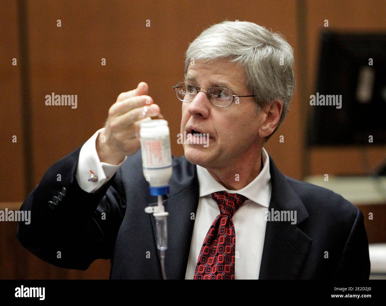 Anesthesiology expert Dr. Steven Shafer holds a bottle of propofol while testifying during Dr. Conrad Murray's involuntary manslaughter trial in Los Angeles on October 20, 2011. Murray has pleaded not guilty and faces four years in prison and the loss of his medical license if convicted of involuntary manslaughter in Michael Jackson's death. Photo by Reed Saxon/Pool/ABACAPRESS.COM Stock Photo