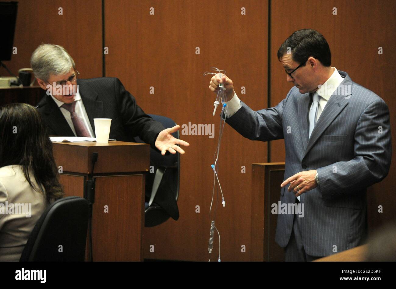 Defense attorney Ed Chernoff (R) holds up an intravenous drip (IV) during cross examination of propofol expert Dr. Steven Shafer (L) during the Dr. Conrad Murray trial in Los Angeles Superior Court in Los Angeles, California, USA on 24 October 2011. Murray has pleaded not guilty and faces four years in prison and the loss of his medical licenses if convicted of involuntary manslaughter in Michael Jackson's death. Photo by Paul Buck/Pool/ABACAPRESS.COM Stock Photo