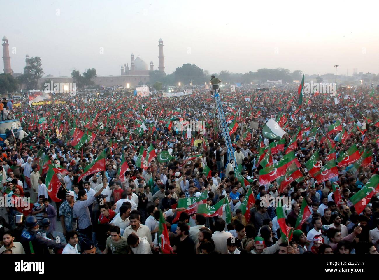 Supporters of Pakistani politician and former cricketer Imran Khan gathered for a rally in Lahore, Pakistan on October 30, 2011. A crowd of thousands gathered called by Khan to press President Asif Ali Zardari to step down. The rally, seen as a show of strength, comes two days after Sharif's brother Shahbaz, attracted some 30,000 people at an anti-Zardari protest also in the key political battleground of Lahore. Photo by Irfan/ABACAPRESS.COM Stock Photo