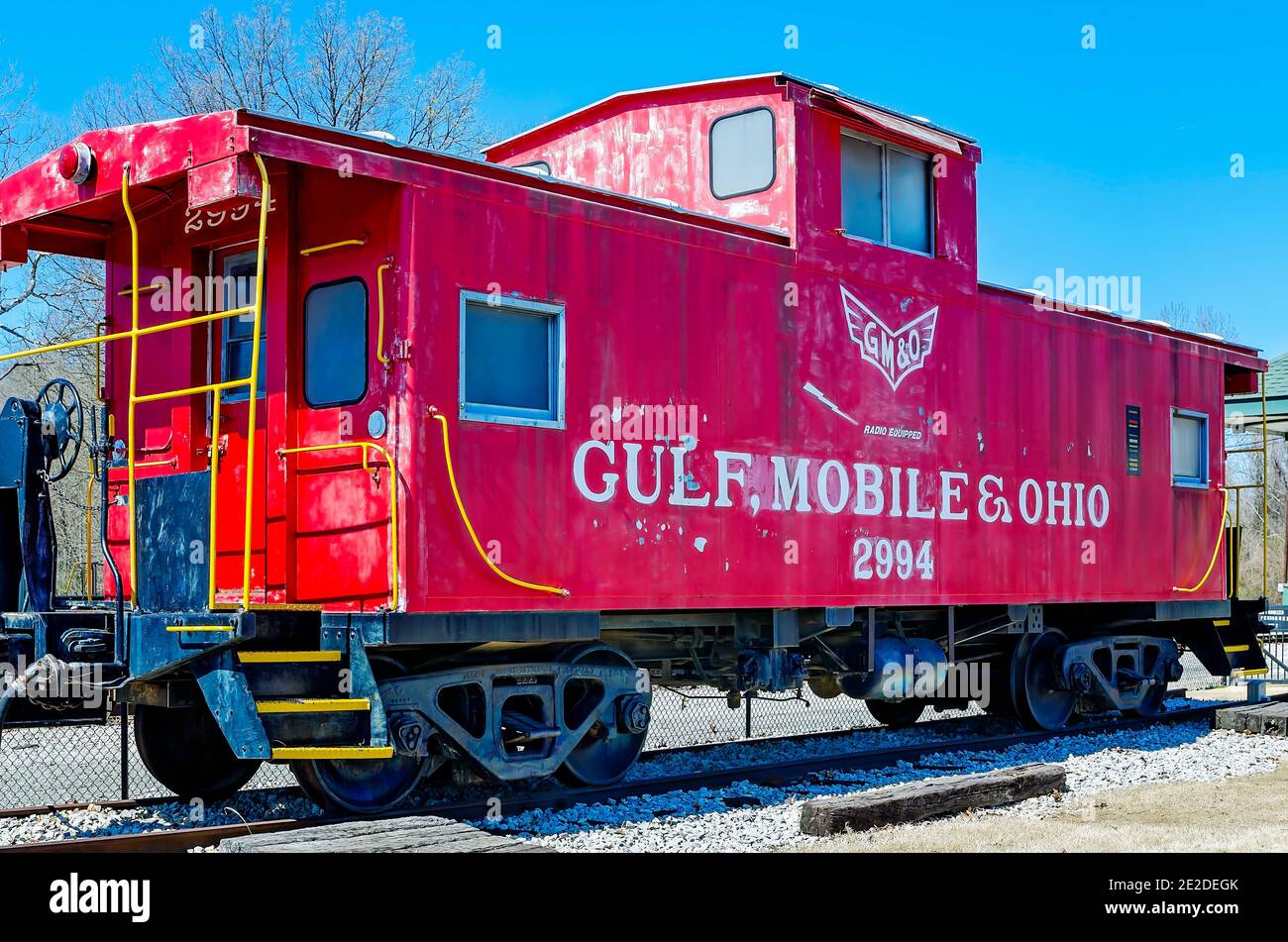 Caboose #2994 of the Gulf, Mobile, and Ohio Railroad, stands on the tracks behind the Corinth Crossroads Museum in Corinth, Mississippi. Stock Photo