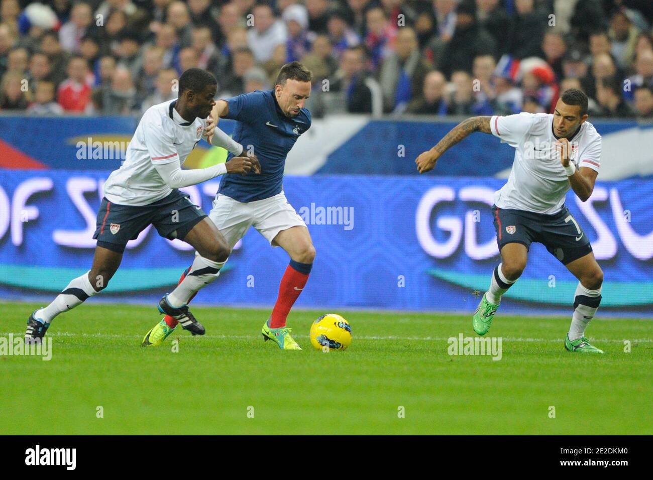 France's Franck Ribery battling USA's Maurice Edu and Danny Williams
