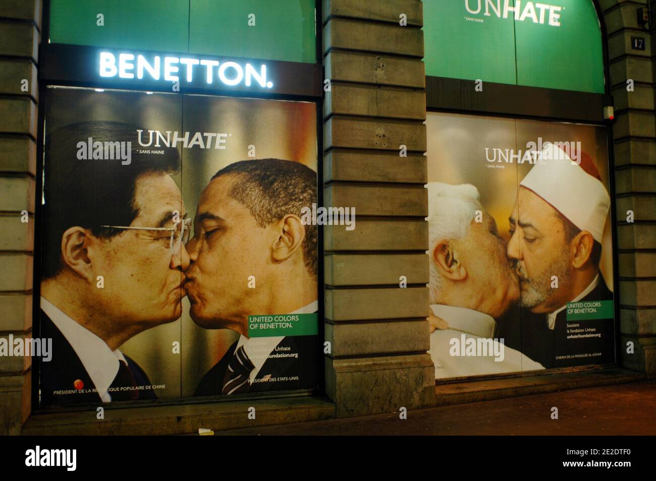 Posters from new Benetton's ad campaign 'Unhate' are on display on it's flagship store windows, Place de l'Opera in Paris, France, November 16, 2011. They show various pictures of political opponents kissing. They included Barack Obama and Venezualan leader Hugo Chavez, German Chancellor Angela Merkel and French President Nicolas Sarkozy, and the Israeli and Palestinian leaders Benjamin Netanyahu and Mahmoud Abbas. The company said the adverts were aimed at fostering tolerance and 'global love' but it prompted a quick reaction from the Vatican. Benetton has been forced to pull a picture of Pop Stock Photo