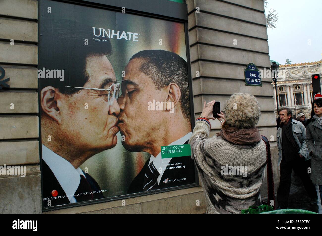 Posters from new Benetton's ad campaign 'Unhate' are on display on it's  flagship store windows, Place de l'Opera in Paris, France, November 17,  2011. They show various pictures of political opponents kissing.